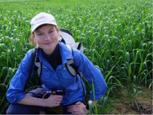 PhD student Ruby Hume in the field.