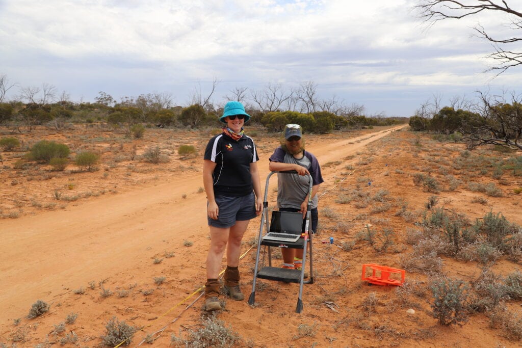 Two people smiling at the camera while conducting experiments in the outback | Featured Image for Critical Zone Observatory Project Kicks off at Calperum Page by TERN.