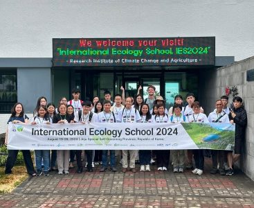 TERN staff and Korean students holding a banner