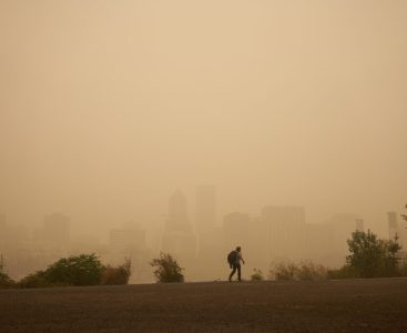 An orange smoke-filled sky is seen above Portland's downtown skyline during the Oregon wildfires.