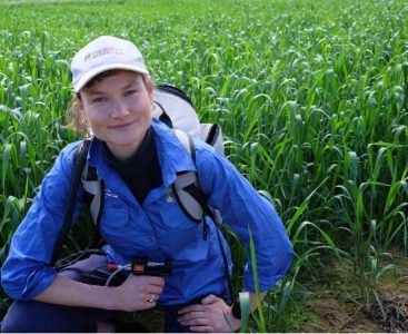 PhD student Ruby Hume in the field