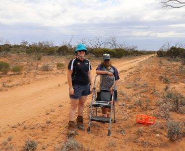 Two people smiling at the camera while conducting experiments in the outback | Featured Image for Critical Zone Observatory Project Kicks off at Calperum Page by TERN.