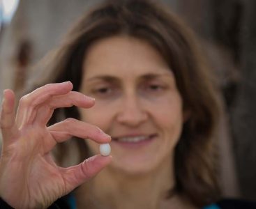Mylene Mariette holding a Zebra Finch egg (credit: Donna Squire)